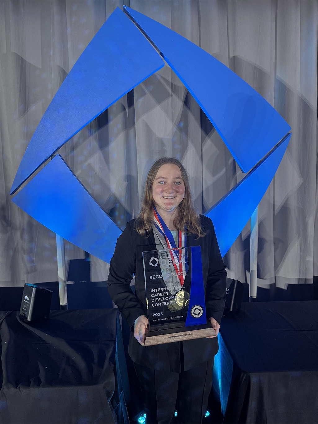 Anna Engeland with her 2nd place trophy at International DECA Competition
