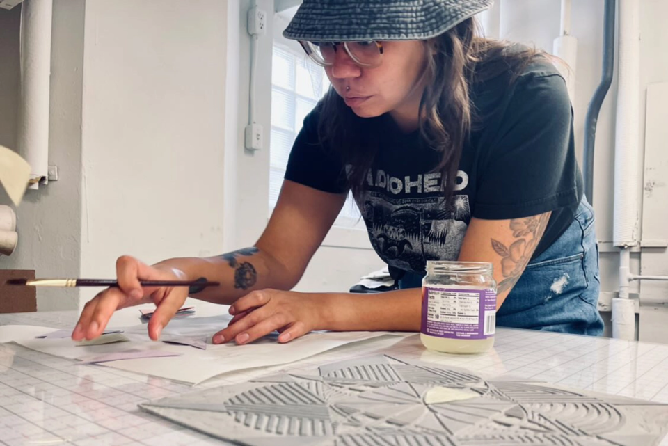 Delia Touch&eacute; creates one of her award-winning drawings