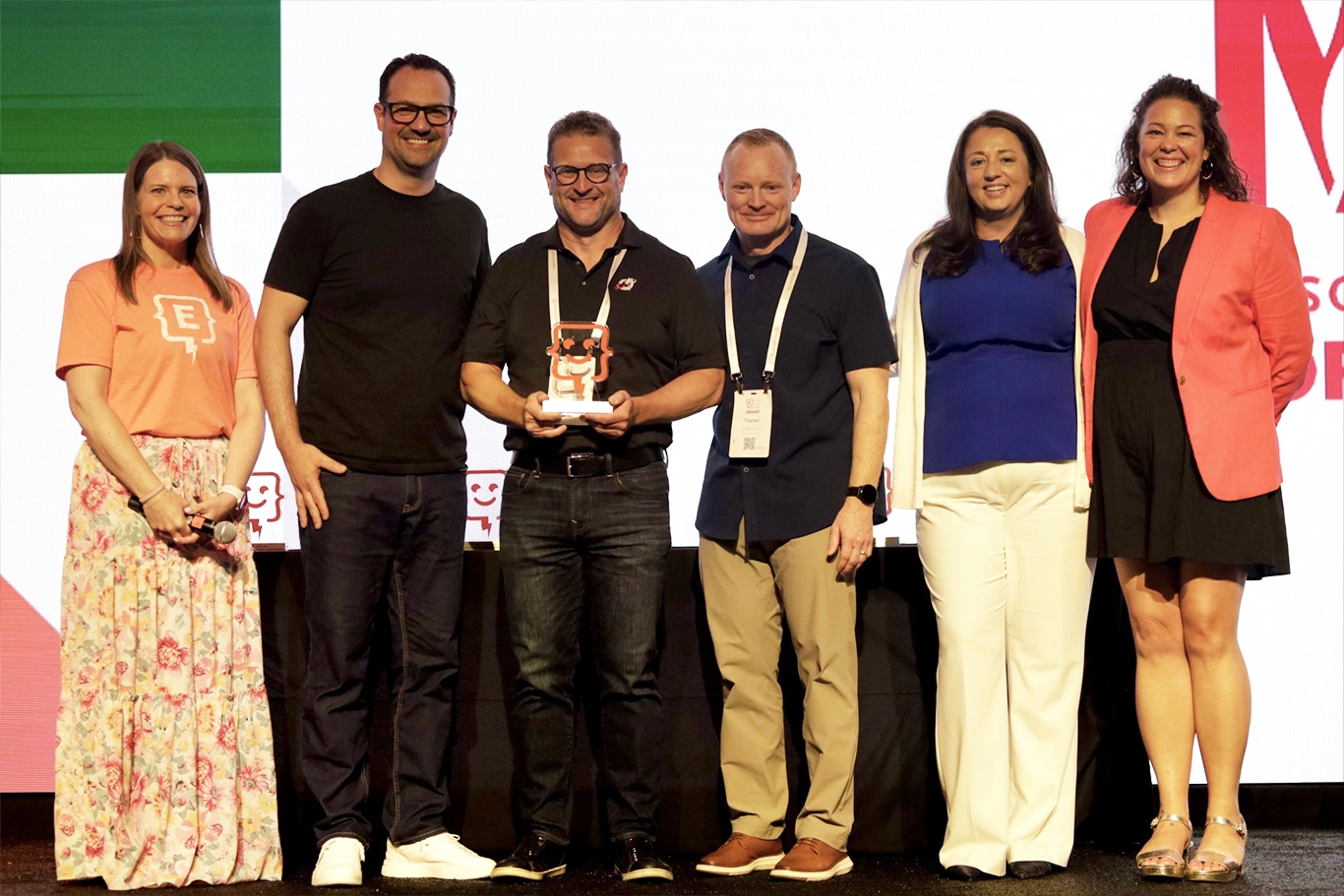 Dr. Josh Riedy and Jason Trainer accept the AI Innovation Award at the Engage Summit 2026.